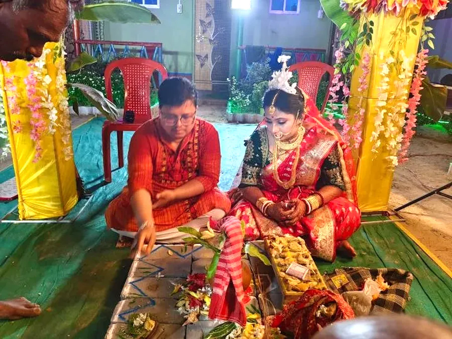 Bride and groom seated at the wedding ritual