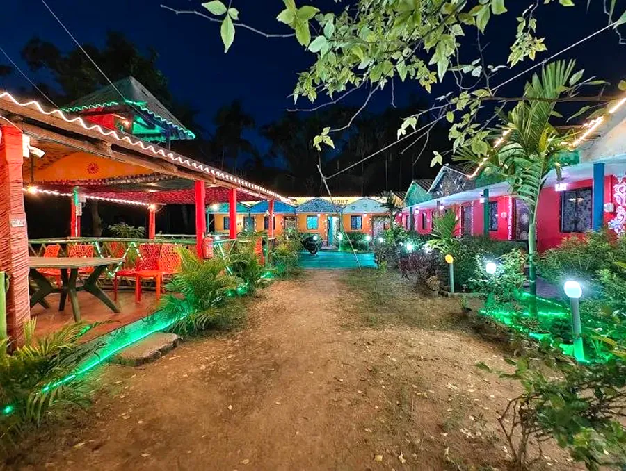 Cottages and garden path lit up at night