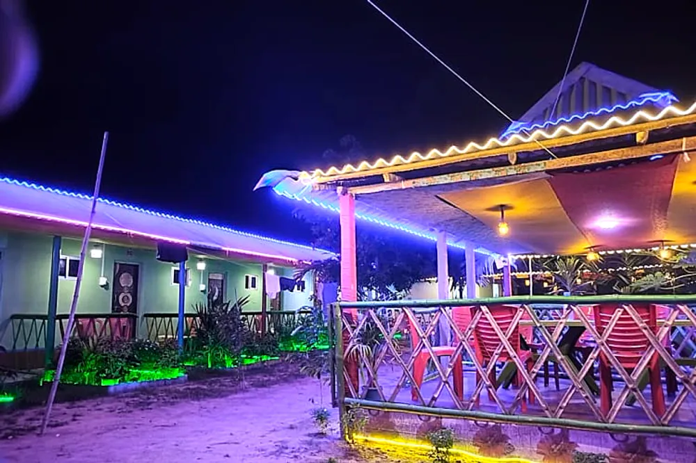 Resort courtyard glowing with lights at night