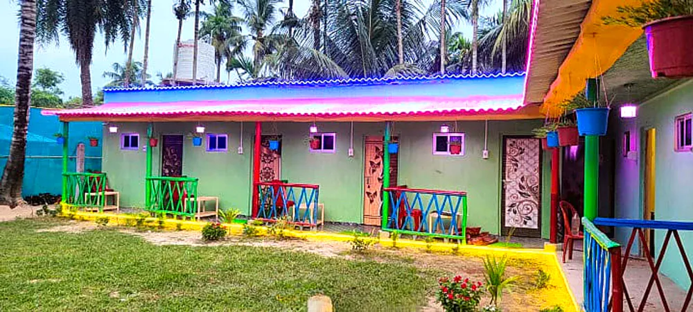 Resort veranda with colourful railings and chairs